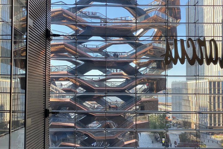 Discover stunning views from the iconic Vessel a honeycomb structure inviting visitors to explore its intricate staircases all while surrounded by the beauty of Hudson Yards and The High Line.